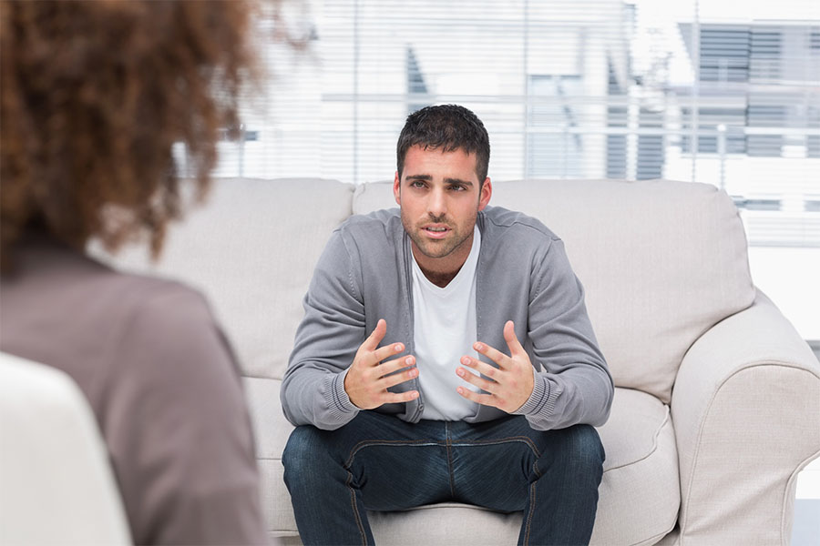 Adult man undergoing individual therapy session as part of partial hospitalization program.