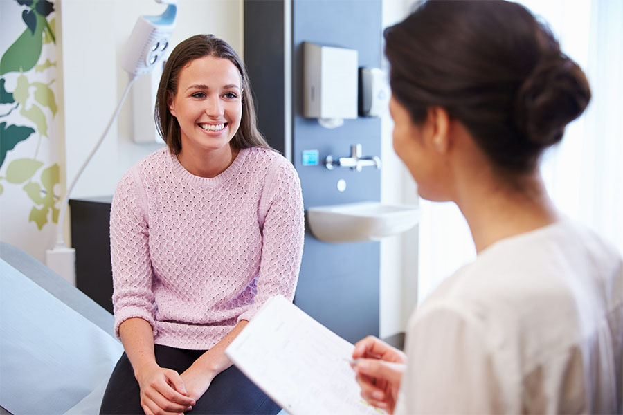 A woman speaking to a drug addiction counselor at Olympus Recovery's addiction treatment center in Delray Beach about medically supervised detoxification