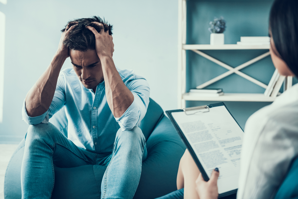 a person at Olympus Recovery working with a therapist using evidence-based therapies as a part of the treatment process during PHP addiction treatment in Delray