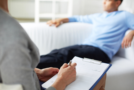 A man in addiction treatment therapy who has a MultiPlan health insurance plan using his health insurance coverage at Olympus Recovery