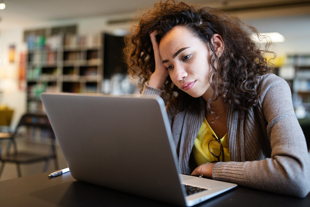 Student girl finding it difficult at study and comprehend school tasks